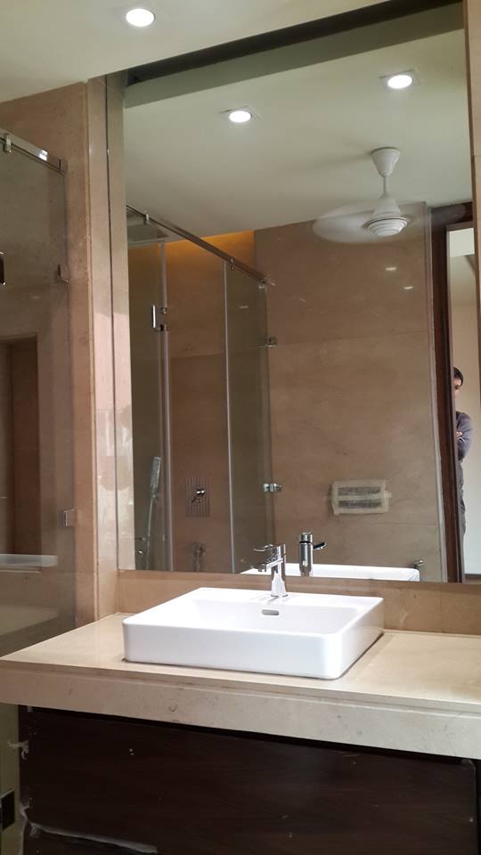 Wall-hung WC with warm cove lighting and marble feature wall — Bathroom 3, GK I Residence