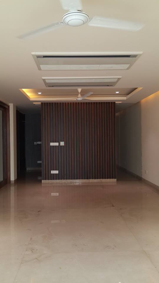 Entry foyer with marble flooring and recessed lighting — GK I Residence