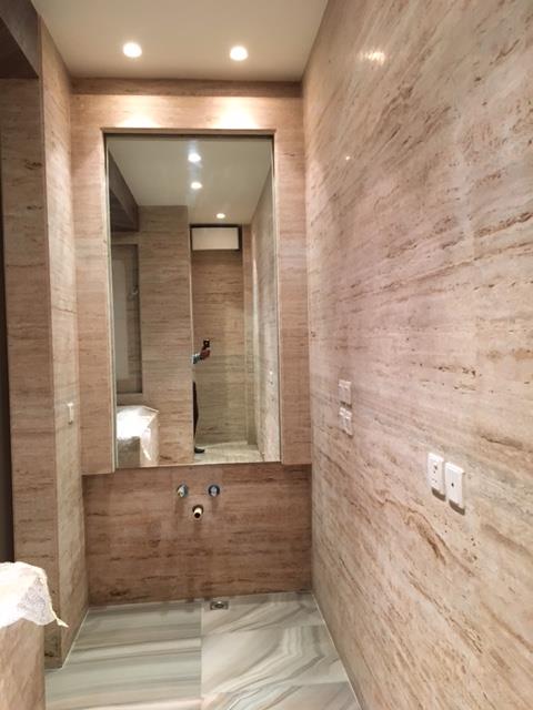Bathroom 6 — Onyx stone with bookmatched veining and recessed cove lighting — Maharani Bagh Residence